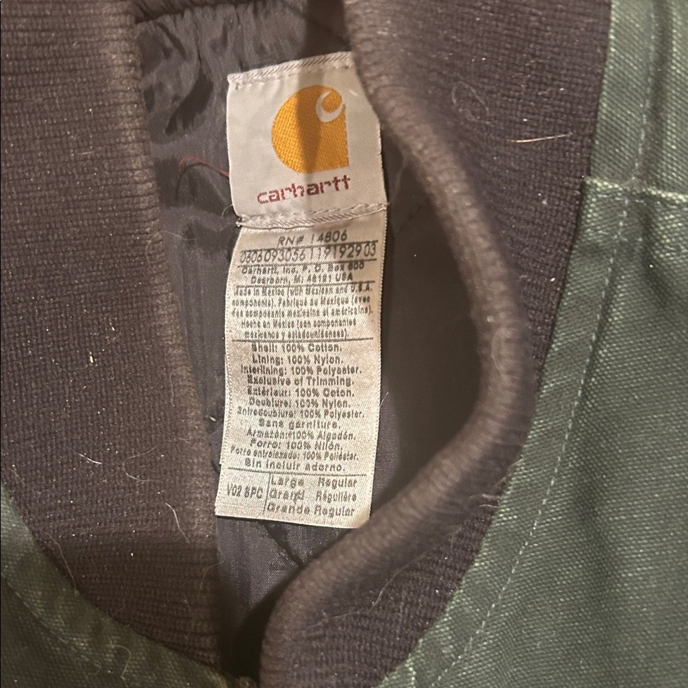 A Carhartt green vest.  Large. Very nice. Quilted lining